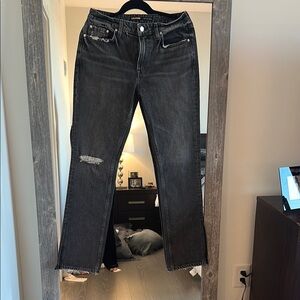 Black Straight Leg Distressed Jeans with slits at the bottom.